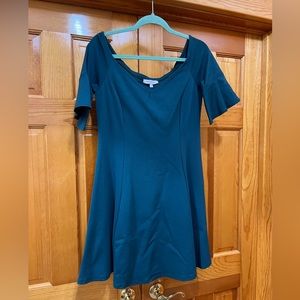 Super cute teal fit and flare dress with flutter sleeves